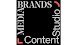 Logo for Media Brands Content Studio. The white text is arranged to form a square border against a solid black background. The word 'MEDIA' is written vertically along the left edge, 'BRANDS' horizontally across the top, 'Studio' vertically along the right edge, and 'Content' horizontally across the bottom. There are bright red, stylized corner brackets in the bottom-left and top-right corners