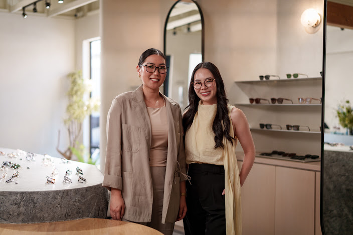COVRY founders smile in their shop.
