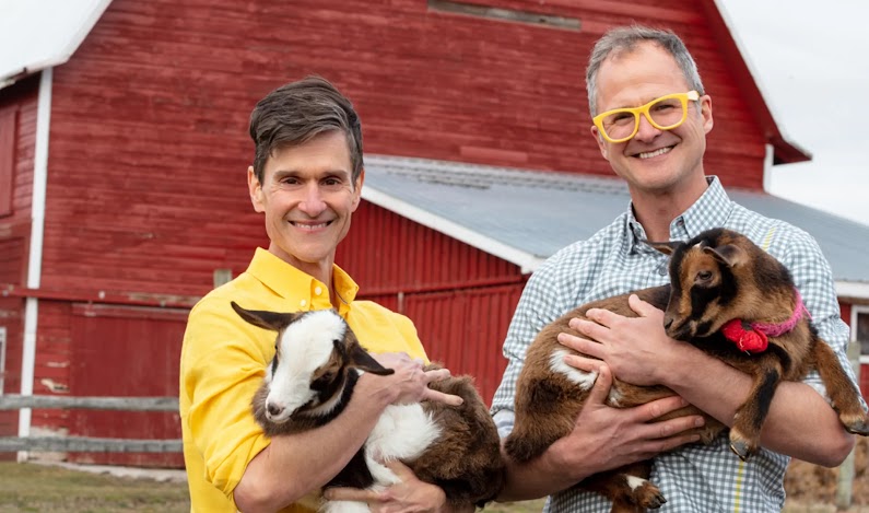 The founders of Beekman 1802 holding baby goats on a farm with the statistic ‘400% ROI in 2021’.