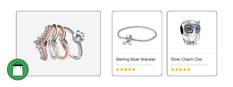 Three jewelry product cards featuring a stack of four silver and rose gold rings with crystals, a Sterling Silver Bracelet with a leaf charm, and a Silver Charm Owl with blue eyes, all including five-star ratings and a shopping bag icon.
