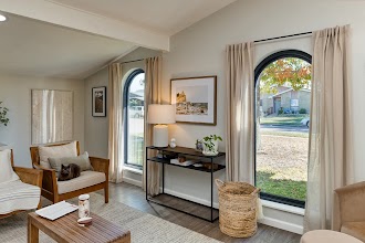 Inside a home with newly replaced arched windows.