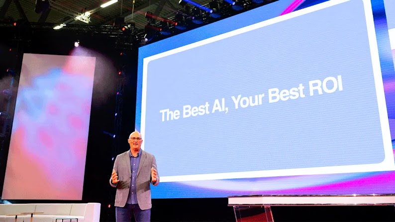 Brendon Kraham, VP of search and commerce, global ads solutions at Google, speaks from the stage at DMEXCO in Cologne, Germany, in front of a pale blue screen with white lettering that reads: The Best AI, Your Best ROI.