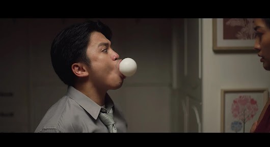 The video thumbnail shows a romantic or surprise scene, likely involving a person receiving an unexpected gift or delivery facilitated by the Grab app.