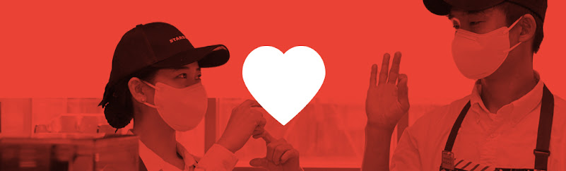 Two Starbucks baristas in Korea using sign language to communicate with one another to ensure greater inclusivity and accessibility for all customers