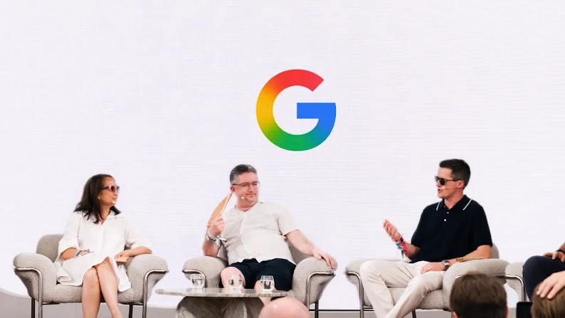 Linda Ha of Ikea, Dan Finley of Debenhams Group, and Andy Wells of DoorDash chat while sitting in comfortable chairs against a gray background with the Google logo at center. Audience members can be seen in the foreground.