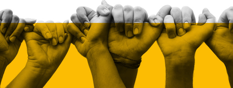 Several people linking hands