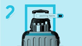 The search term “packing hacks” appears in a YouTube search bar over a toiletry kit resting on top of carry-on luggage. Four travel-size bottles are lined up in front of the kit.