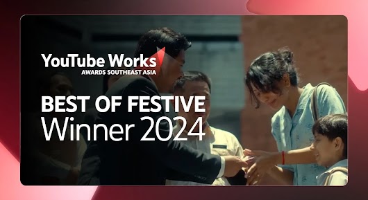 A man in a black suit shakes hands with a woman who is smiling and looking down, with a small boy visible next to her, in a brightly lit outdoor setting. Large white text is overlaid on the left side of the screen, reading: "BEST OF FESTIVE Winner 2024," positioned below the YouTube Works Awards Southeast Asia logo.