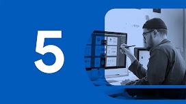 Chapter 5. A bearded designer wearing a knit cap and glasses sits in front of a large monitor while reviewing creative executions.