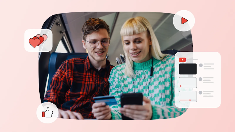 A young man and a blonde woman sit on a train, smiling as they look at a smartphone and hold a credit card. Floating around them on a pink background are social media UI icons, including a video playlist, hearts, and a thumbs-up.