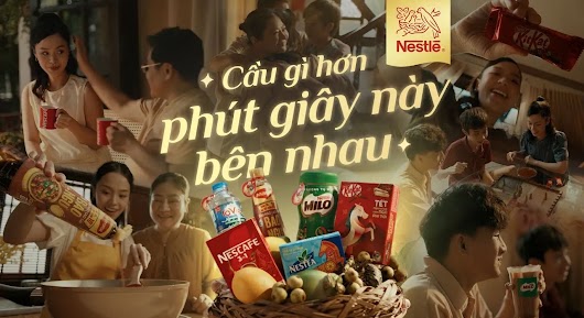 A warm-toned Nestlé campaign thumbnail showing a collage of happy family moments gathered around a basket of Nestlé products, with text reading "Cầu gì hơn phút giây này bên nhau