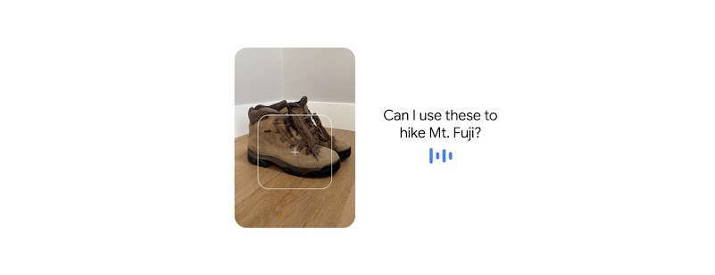 A camera’s viewfinder hovers over a pair of hiking boots. A user asks, “Can I use these to hike Mt. Fuji?”