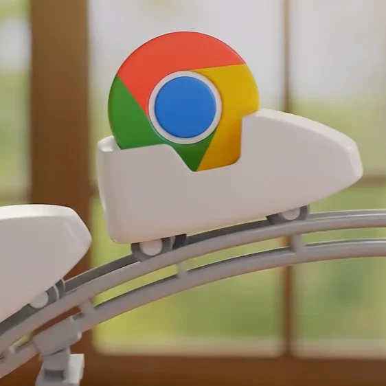 The Chrome logo riding in a roller coaster car.