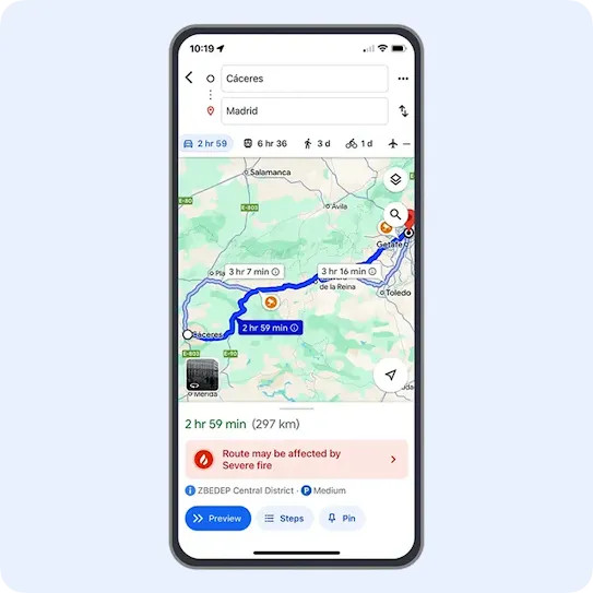 A smartphone screen displaying a Google Maps navigation route between Cáceres and Madrid. The map highlights a blue driving path, and a red warning banner appears below the map reading "Route may be affected by Severe fire."