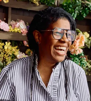 A photograph of Brandi Shelton, the founder and owner of Just Add Honey Tea Company based in Atlanta, Georgia.