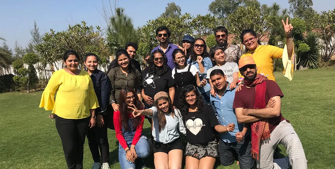 The Zyla team pose in daylight at a park.