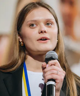 Woman holding a mic.