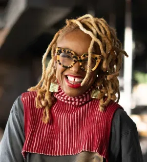 A photograph of Angel Gregorio, the founder and CEO of spice shop The Spice Suite and Black and Forth, a community-centric strip mall, in Washington, D.C.