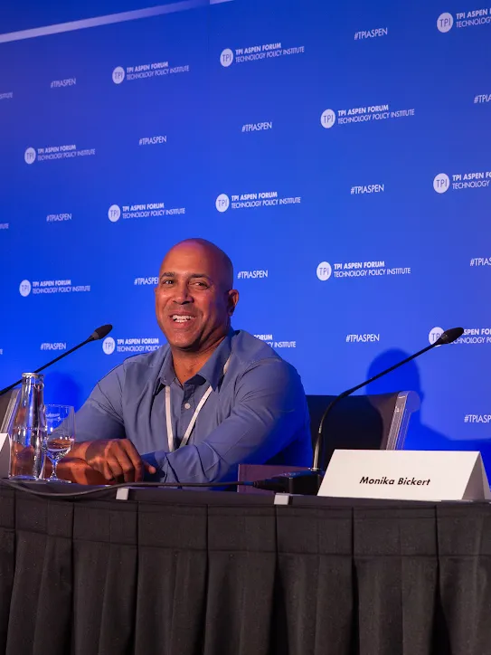 Google’s David Graff and Meta’s Monika Bickert laughing during a panel discussion at the TPI Aspen Forum.