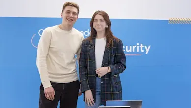 A man and woman posing for picture.