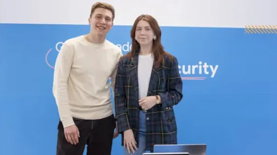 A man and woman posing for picture.