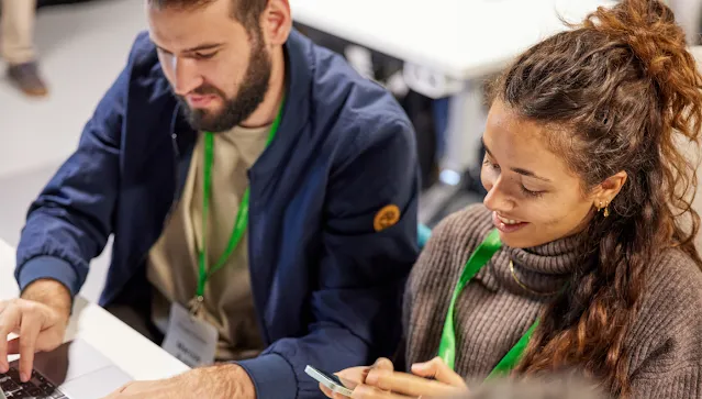 A man in a blue jacket and a woman