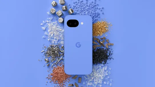 A top-down view of a light blue Google Pixel smartphone surrounded by organized piles of raw recycled materials, including copper shavings, aluminum bits, glass shards, and plastic pellets, all set against a matching blue background.