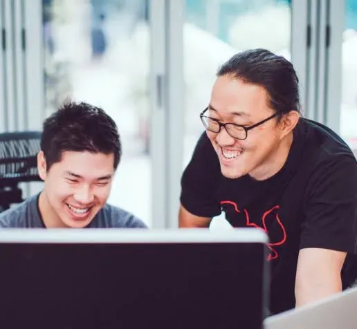 Two boys are smiling.