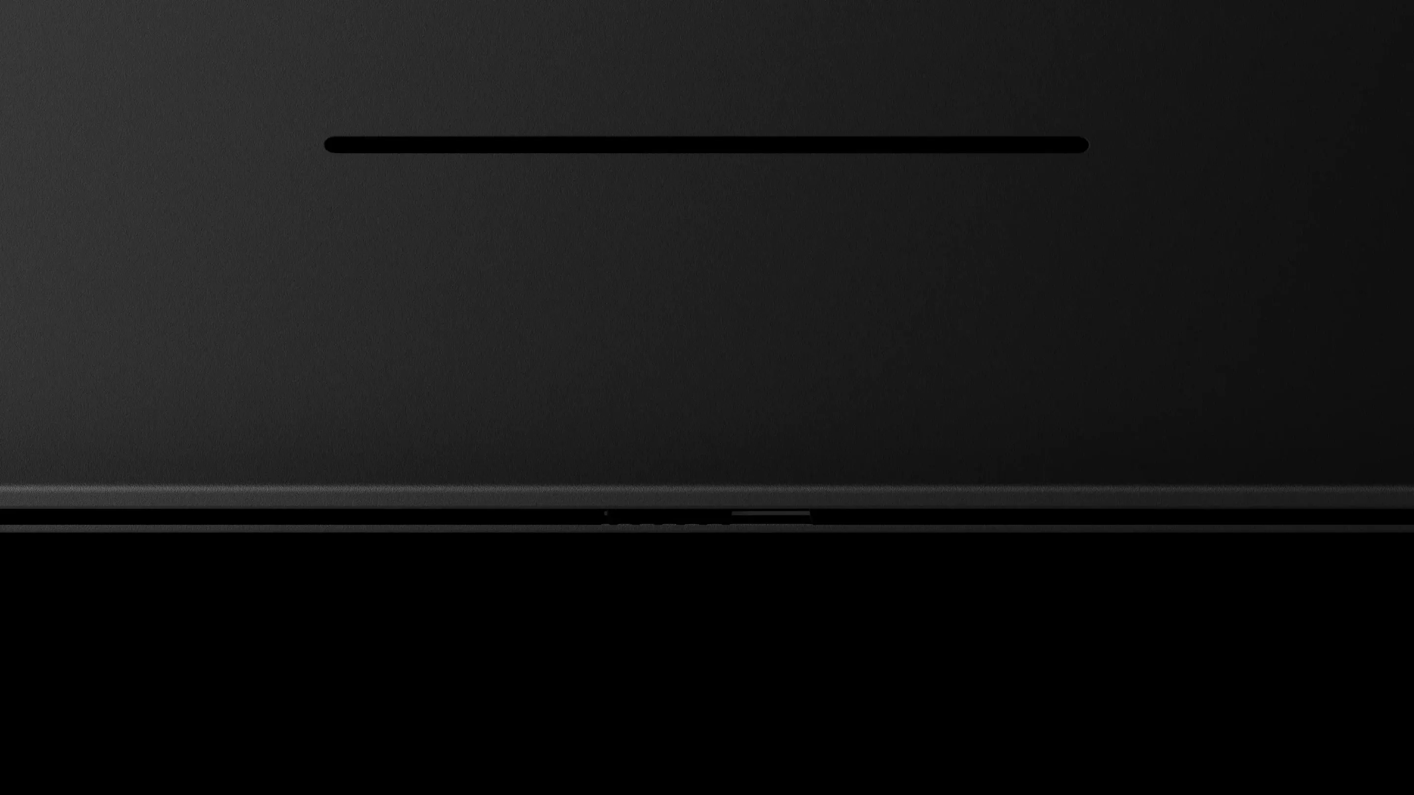 Close-up of the Googlebook glowbar lighting up as the device powers on.