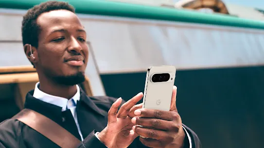 Image of a man scrolling through his Google pixel phone.