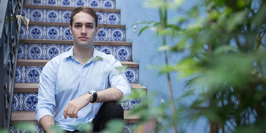 a person is seated on the stairs.
