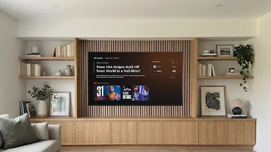 Image of a Google TV device displaying an NBA brief in a bright living room.