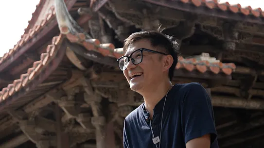 Googler Jerry Kuo sits outside a temple in Changhua County, Taiwan