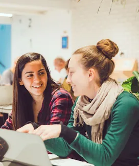Woman chatting with a man, smiling.