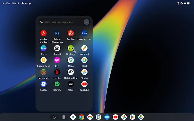 Desktop window of search field with suggestive text “Search apps from your phone”, and grid of mobile apps.
