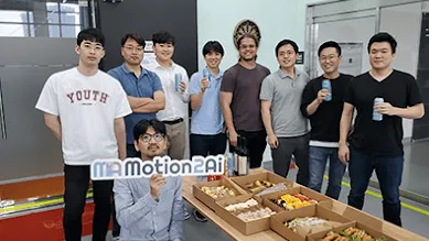 A driver and their red forklift are driving through a warehouse.