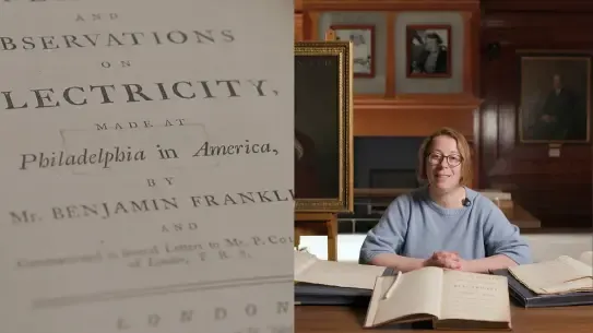 close up of Ben Franklin’s research and woman showing his manuscripts
