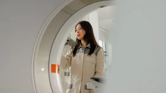A woman standing in front of a machine
