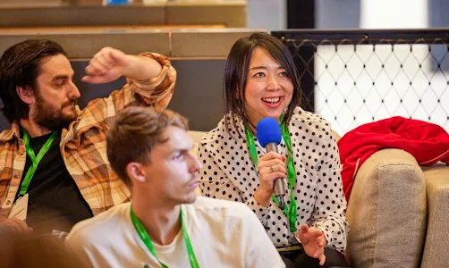 A woman holding the mic in hand