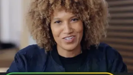 A close-up portrait of a woman with curly hair speaking to the camera. At the bottom of the frame, a dark bar features the text "AI Professional" within a colorful Google-themed border, representing the Google AI Professional Certificate course for practical AI skills.
