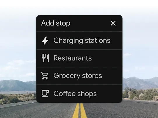 A Google Maps screen with option to add EV charging stop. Behind it is a highway with a mountain range in the background.