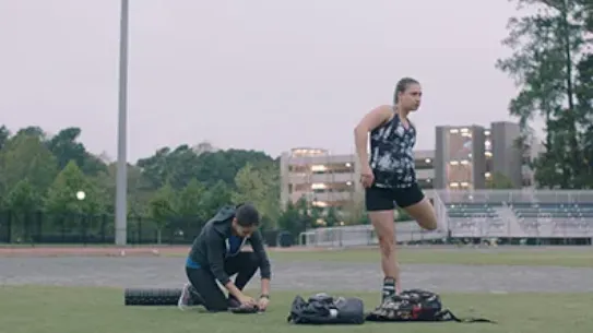 Founders Ivonna Dumanyan and Gabrielle Levac are sitting side by side at a desk during a meeting smiling.