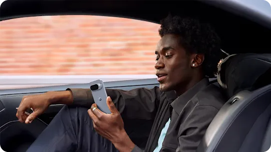 Image of a man using his Android-powered device