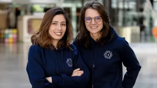Two women posing for a picture.