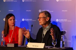 Google Chief Economist Hal Varian speaking with hand gestures during a policy panel at the TPI Aspen Forum.