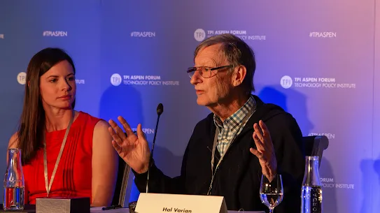 Google Chief Economist Hal Varian speaking with hand gestures during a policy panel at the TPI Aspen Forum.