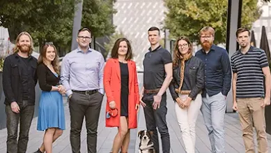 The Attention Insight poses for the camera outside during the day.