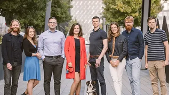 The Attention Insight poses for the camera outside during the day.