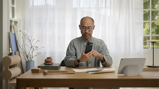 Image of a man using his Android-powered device.