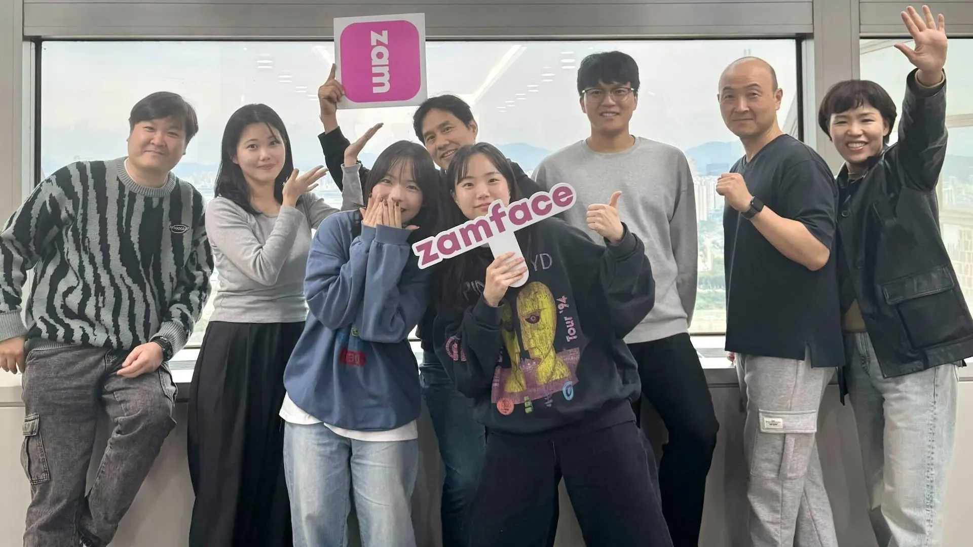 The Zamface team smiling and posing in their South Korean office